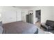 Bright bedroom with ensuite bathroom, featuring a spacious bed, dresser with mirror, and large closet at 3322 Wye Oak Dr, Apopka, FL 32703