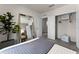 Bright bedroom features a large mirror, closet, and doorway leading to another room at 3322 Wye Oak Dr, Apopka, FL 32703