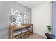 Cozy dining area features a long wooden table, three stools, unique mirror art, and neutral paint at 3322 Wye Oak Dr, Apopka, FL 32703
