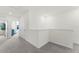 Hallway with neutral carpet, white walls, and a view of the bedrooms at 3322 Wye Oak Dr, Apopka, FL 32703