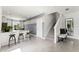 Open living area with barstool seating at the kitchen island and view of the staircase at 3322 Wye Oak Dr, Apopka, FL 32703