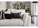 Cozy living room with stylish pillows, a modern mirror decor, lamp, and a side table at 3322 Wye Oak Dr, Apopka, FL 32703