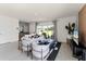 Open-concept living room showcases tile flooring, neutral color palette, and a large window for natural light at 3322 Wye Oak Dr, Apopka, FL 32703