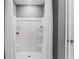 An enclosed stand up shower with shelves for storage and an adjustable shower head at 3322 Wye Oak Dr, Apopka, FL 32703