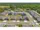 Aerial neighborhood view showcases houses, streetscapes, green spaces, and ponds at 3351 Pine Timber Pt, Oviedo, FL 32765