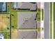 An aerial view of the house shows the roof, yard, street and surrounding houses at 3351 Pine Timber Pt, Oviedo, FL 32765