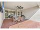 Covered back patio with brick flooring and patio furniture at 3351 Pine Timber Pt, Oviedo, FL 32765