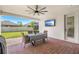 Covered back patio with brick flooring, a ceiling fan, and outdoor seating at 3351 Pine Timber Pt, Oviedo, FL 32765