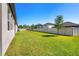 Large backyard with a well-maintained lawn and white vinyl fencing at 3351 Pine Timber Pt, Oviedo, FL 32765