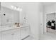 Bright and spacious bathroom featuring double sinks and white cabinets at 3351 Pine Timber Pt, Oviedo, FL 32765