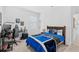 Bedroom area featuring a game-themed comforter and a gaming desk at 3351 Pine Timber Pt, Oviedo, FL 32765