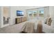 Primary bedroom with large windows and a door to the lanai at 3351 Pine Timber Pt, Oviedo, FL 32765
