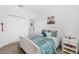 Cozy bedroom with a white bed frame, neutral carpet, and a double door closet at 3351 Pine Timber Pt, Oviedo, FL 32765
