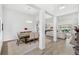 Bright dining area featuring stylish decor, decorative columns, and views into the living room at 3351 Pine Timber Pt, Oviedo, FL 32765