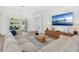 Living room featuring a comfortable sectional couch with view of the outdoor patio through sliding glass doors at 3351 Pine Timber Pt, Oviedo, FL 32765