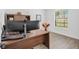 Functional home office with modern desk, ample natural light, and stylish wood-look flooring at 3351 Pine Timber Pt, Oviedo, FL 32765