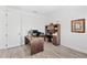 Well-appointed home office featuring a large desk, built-in shelving, and neutral decor at 3351 Pine Timber Pt, Oviedo, FL 32765
