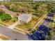 Aerial view of a two-story house surrounded by lush green landscaping at 34000 Fortunado St, Sorrento, FL 32776