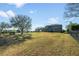 Expansive backyard featuring an iron fence and a gently sloping lawn, offering lots of room to enjoy at 34000 Fortunado St, Sorrento, FL 32776