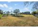 Large backyard with a black metal fence at 34000 Fortunado St, Sorrento, FL 32776