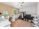Bedroom features a ceiling fan, a window, and storage options at 34000 Fortunado St, Sorrento, FL 32776