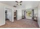 Bedroom showcasing neutral colors and multiple doorways to other rooms at 34000 Fortunado St, Sorrento, FL 32776