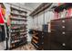 Organized walk-in closet with custom shelving, shoe racks, and drawers for efficient storage at 34000 Fortunado St, Sorrento, FL 32776