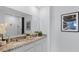 Elegant bathroom featuring granite countertops, dual sinks, and ample lighting at 3615 Salvia Ct, Tavares, FL 32778