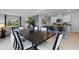 Open-concept dining area with view of kitchen and living room at 3615 Salvia Ct, Tavares, FL 32778