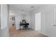 Bright hallway featuring a desk and chair, with views into adjacent rooms at 3615 Salvia Ct, Tavares, FL 32778