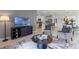 Open-concept layout showcasing a living room seamlessly connected to the kitchen and dining area at 3615 Salvia Ct, Tavares, FL 32778