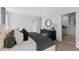 Spacious main bedroom featuring neutral tones and a view into the attached bathroom at 3615 Salvia Ct, Tavares, FL 32778