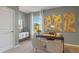 Home office with neutral decor and art, providing a quiet and functional work environment at 3615 Salvia Ct, Tavares, FL 32778