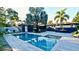 Beautiful backyard oasis featuring a luxurious pool, patio and plenty of space for entertaining at 3714 Virginia Dr, Orlando, FL 32803