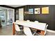 Dining area featuring a modern table, stylish chairs and access to the outdoor spaces at 3714 Virginia Dr, Orlando, FL 32803