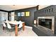 Modern dining area with stylish lighting, contemporary furnishings, and a cozy fireplace at 3714 Virginia Dr, Orlando, FL 32803