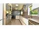 Modern kitchen featuring sleek appliances, ample counter space, and stylish design at 3714 Virginia Dr, Orlando, FL 32803