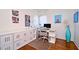 Bright office space featuring sleek desk, modern chair, and white storage cabinets for organized workspace at 3714 Virginia Dr, Orlando, FL 32803
