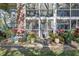 Outdoor patio area with lush plants and private access to the property at 3800 Saxon Dr # 19B, New Smyrna Beach, FL 32169