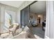 Inviting balcony with wicker seating and access to a cozy living space at 3800 Saxon Dr # 19B, New Smyrna Beach, FL 32169