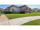 The exterior side of the condo complex has meticulously maintained greenery and pedestrian walkways at 3800 Saxon Dr # 19B, New Smyrna Beach, FL 32169