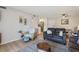 An inviting living room with modern furnishings, light wood floors and a comfortable seating arrangement at 3800 Saxon Dr # 19B, New Smyrna Beach, FL 32169