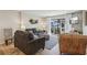 A comfortable living room with sofas, natural light, and cozy decor, perfect for relaxing and entertaining guests at 3800 Saxon Dr # 19B, New Smyrna Beach, FL 32169