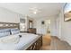 Spacious main bedroom with a ceiling fan, decorative furnishings, and ensuite bathroom at 3800 Saxon Dr # 19B, New Smyrna Beach, FL 32169