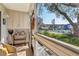 Relaxing patio with serene views of the community pool and lush landscaping at 3800 Saxon Dr # 19B, New Smyrna Beach, FL 32169