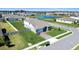 Aerial view of home with a spacious lawn, complemented by a nearby lake and scenic neighborhood at 4210 Sunset Preserve Blvd, Orlando, FL 32820