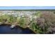 Scenic aerial view of a lakefront community with docks and lush trees at 4210 Sunset Preserve Blvd, Orlando, FL 32820