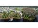 Community aerial view showcases serene lakefront properties with lush greenery at 4210 Sunset Preserve Blvd, Orlando, FL 32820
