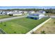 Large backyard showcasing the green lawn and a view of the neighborhood at 4210 Sunset Preserve Blvd, Orlando, FL 32820