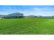 Extensive backyard with green lawn and black fence, ideal for outdoor activities and privacy at 4210 Sunset Preserve Blvd, Orlando, FL 32820